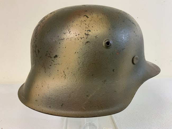 THIRD REICH GERMANY WWII M42 COMBAT NORMANDY CAMO PAINTED HELMET: WWII GERMAN M42 COMBAT NORMANDY CAMO PAINTED HELMET. VERY NICE GREAT EXAMPLE OF COMBAT PAINTED M42 SHELL. INCLUDED LEATHER LINING IN WORN CONDITION . PAINTED INSIDE AS WELL. VISIBLE SIZE 64 STAMPED.