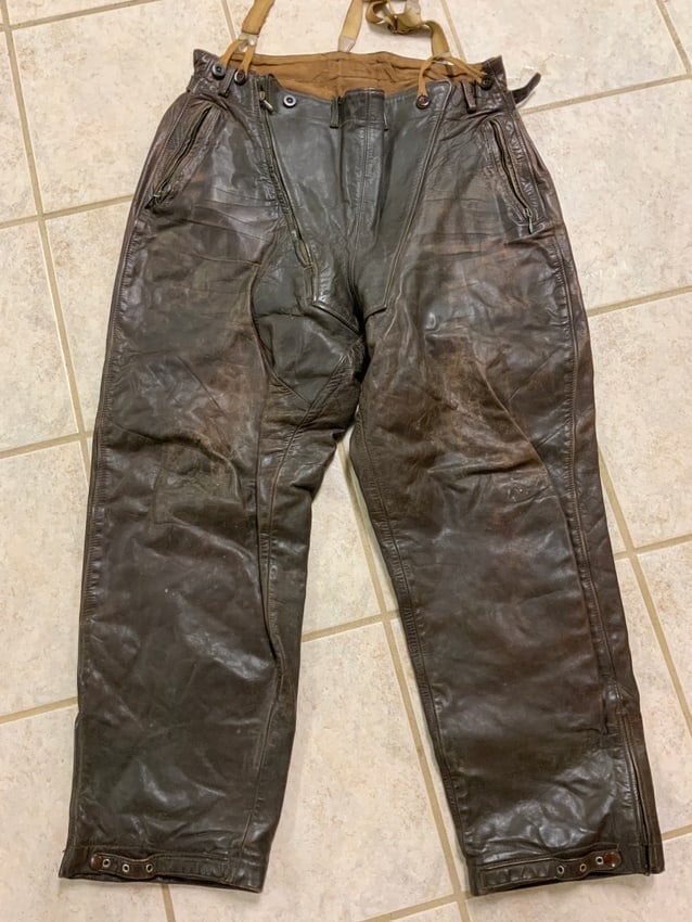 WWII GERMAN LUFTWAFFE PILOTS COLD WEATHER FLYING LEATHER PANTS: WWII GERMAN LUFTWAFFE PILOTS COLD WEATHER FLYING LEATHER PANTS . GREAT OVERALL CONDITION. BROWN LEATHER DISPLAYS NORMAL WEAR AND AGE. ALL ZIPPERS ARE STILL IN WORKING CONDITION. ATTACHED ORIGINAL SUSP