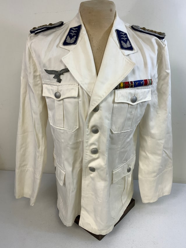 WWII GERMAN LUFTWAFFE DOCTOR MEDICAL OFFICER SUMMER WHITE DRESS TUNIC: WWII GERMAN LUFTWAFFE DOCTOR MEDICAL OFFICER SUMMER WHITE DRESS TUNIC. NICE AND CLEAN EXAMPLE WITH EXTENSIVE SERVICE MEDAL BAR. RARE TO FIND.