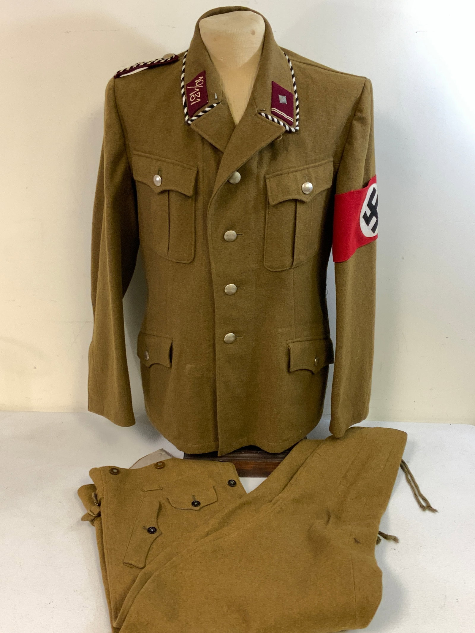 GERMANY THIRD REICH SA OFFICER UNIFORM TUNIC AND BREECHES: GERMANY THIRD REICH SA OFFICER UNIFORM TUNIC AND BREECHES. PRE 1939 SA BERGROCK IN MINT CONDITION. OBERSCHARFUHRER RANK. WESTFALEN. NICE RZM TAG INSIDE. ALSO MINT CONDITION SA BREECHES WITH RZM TAG. G