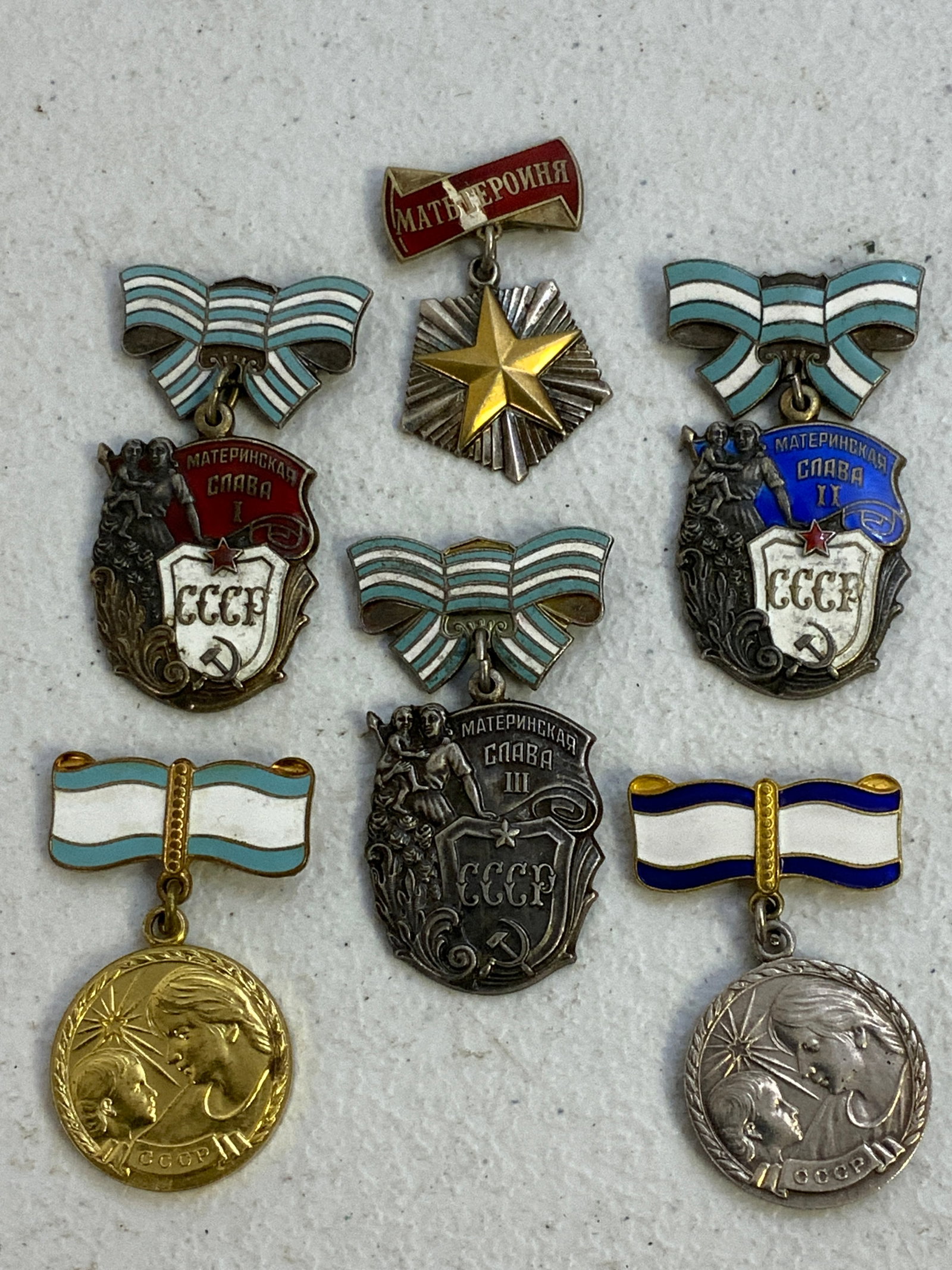 USSR SOVIET MOTHER HEROINE FULL SET OF AWARDS: USSR SOVIET MOTHER HEROINE FULL SET OF AWARDS. INCLUDES GOLD AND SILVER MOTHER HEROINE ORDER.