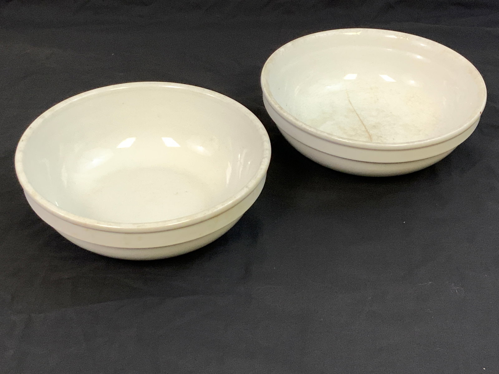 GERMANY THIRD REICH SERVING BOWLS DAF GERMAN LABOR FRONT MARKED: GERMANY THIRD REICH SERVING BOWLS DAF GERMAN LABOR FRONT MARKED. LOT OF 2. ONE IS PERFECT OTHER HAS HAIRLINE CRACKS. 8 1/2" DIAM. 3' TALL SIZE.