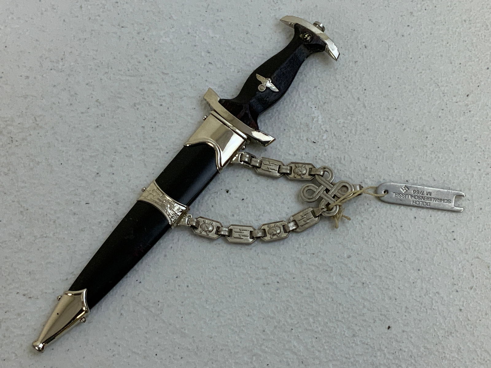 SS OFFICER MINIATURE CHAINED DAGGER: SS OFFICER MINIATURE CHAINED DAGGER. 7" LONG WITH 4 1/2" LONG BLADE.