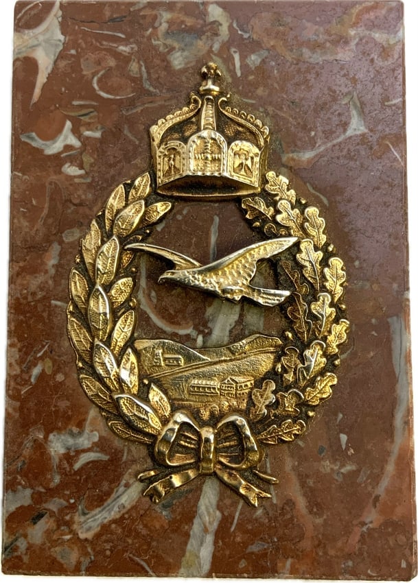 WWI IMPERIAL GERMANY FLYERS COMMEMORATIVE BADGE DESK DECORATION: WWI IMPERIAL GERMANY FLYERS COMMEMORATIVE BADGE DESK DECORATION. BADGE AFFIXED TO A STONE BASE. 2 1/2 X 3 1/2 X 3/4 SIZE.