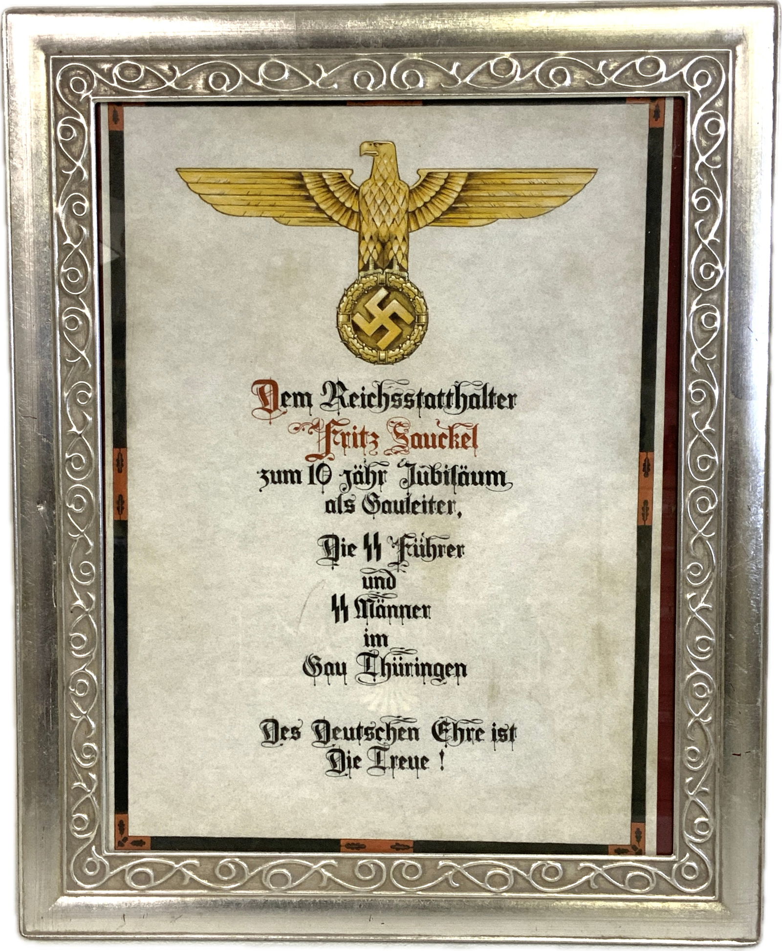 THIRD REICH GERMAN FRAMED DOCUMENT TO A GAULEITER AND SS GENERAL FRITZ SAUCKEL FROM SS OF THURINGEN: NAZI GERMAN FRAMED DOCUMENT TO A GAULEITER AND SS GENERAL FRITZ SAUCKEL FROM SS OF THURINGEN. RARE COLOR DOCUMENT ON HIS 10YEARS ANNIVERSARY AS GAULEITER OF THURINGIA. FROM SS LEADER AND MAN. LARGE SI