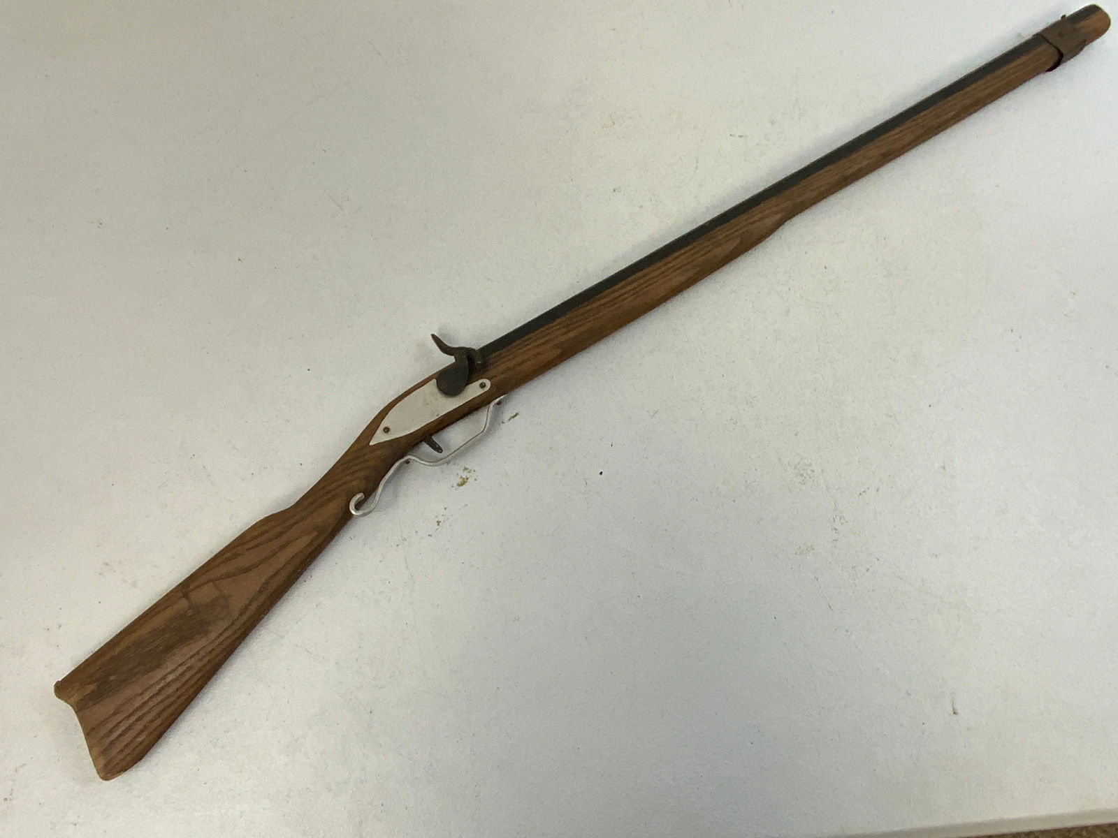 VINTAGE TOY RIFLE: VINTAGE TOY RIFLE. WELL USED. CHILD'S NAME ON THE SIDE PLATE. 36" LONG.