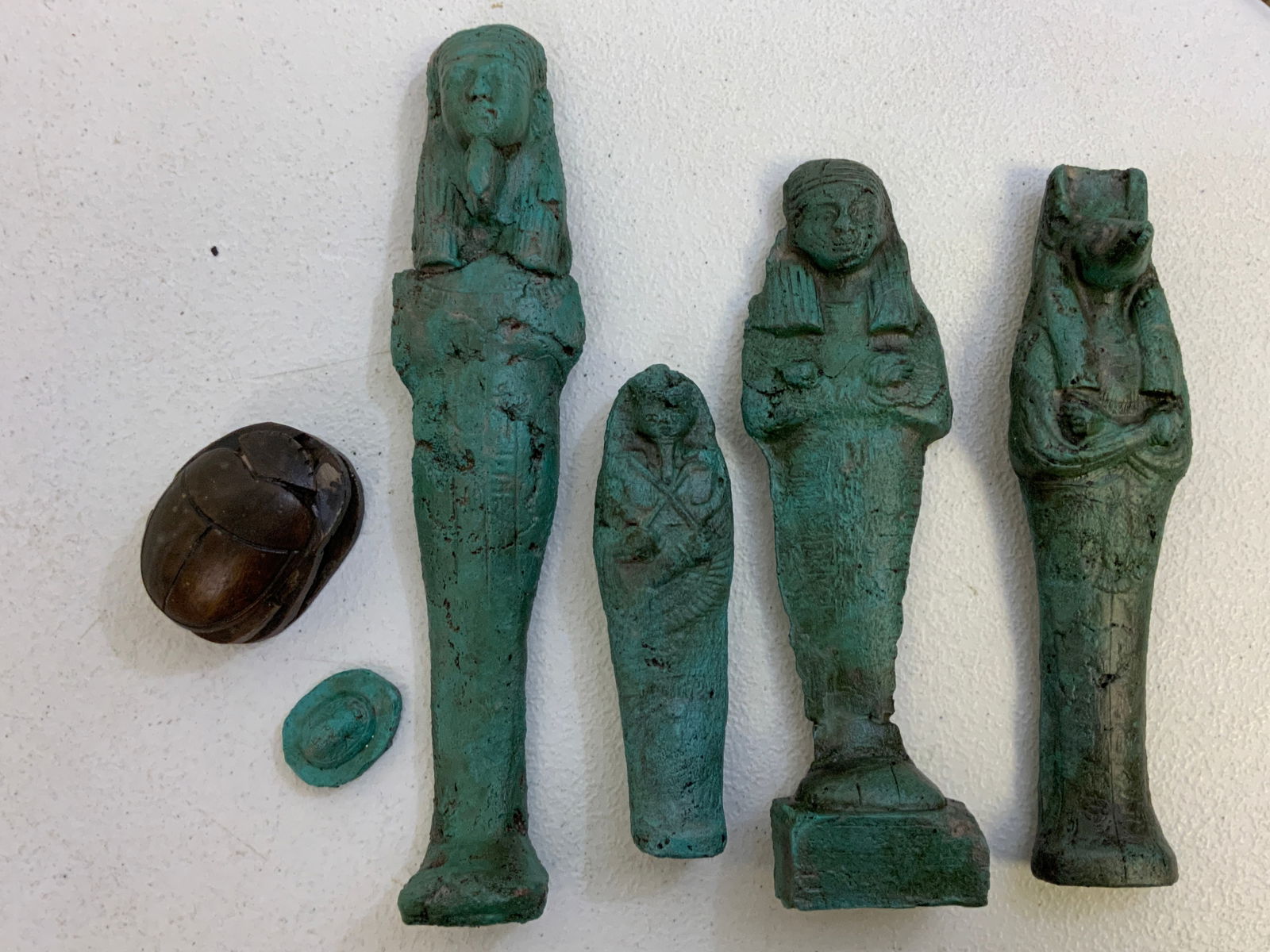 EGYPT GROUP OF USHABTIS AND SCARABS: EGYPT GROUP OF USHABTIS AND SCARABS. ANTIQUE REPAIRS. 9 1/2" LARGEST . EX.TURIN COLLECTION, ITALY.FROM PIECES. FROM DR. PAUL D. LYNN COLLECTION.