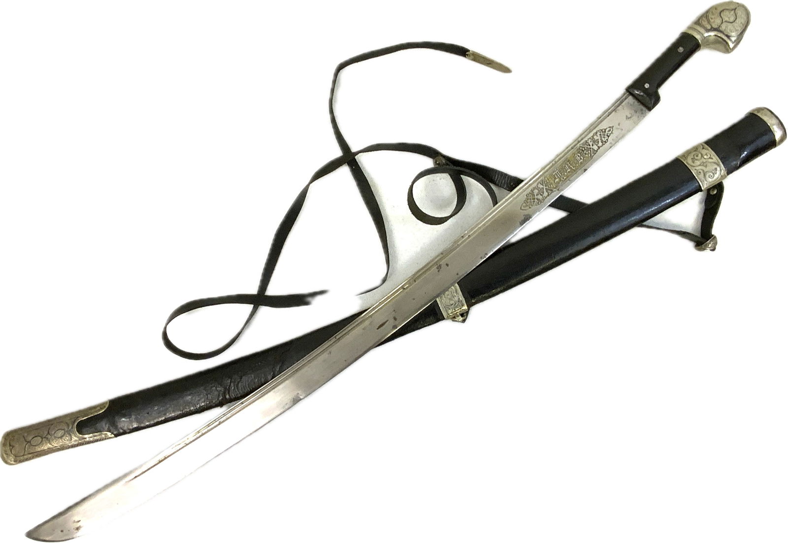 ANTIQUE RUSSIAN TEREK COSSACK CAUCASIAN SILVER DECORATED SHASHKA SWORD TKV: ANTIQUE RUSSIAN TEREK COSSACK CAUCASIAN SILVER DECORATED SHASHKA SWORD. BEAUTIFUL PIECE WITH BRIGHT BLADE MARKED TKV FOR TEREK COSSACK ARMY. BEAUTIFUL SILVER DECORATED FITTINGS. BLACK LEATHER ON THE S