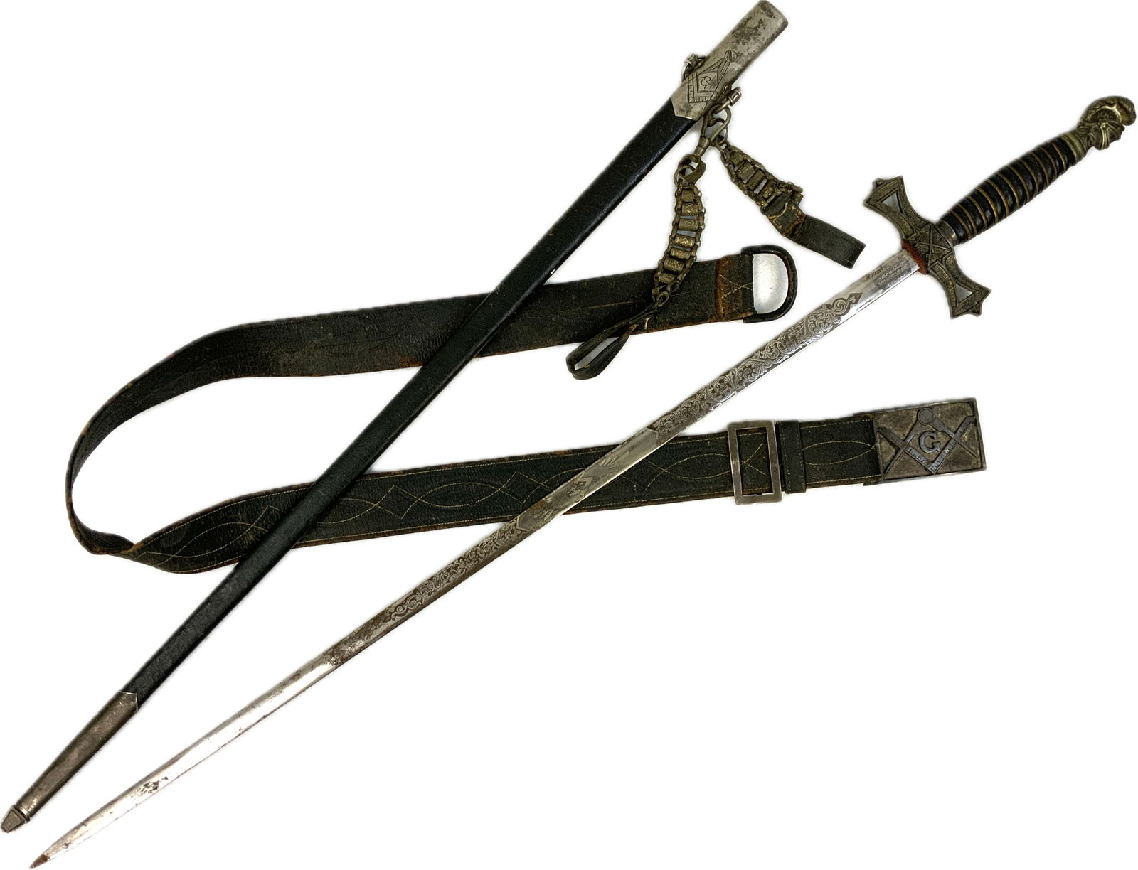 ANTIQUE US FRATERNAL MASONIC DRESS AND CEREMONIAL SWORD WITH BELT AND HANGERS: ANTIQUE US FRATERNAL MASONIC DRESS AND CEREMONIAL SWORD WITH BELT AND HANGERS. VERY NICE EXAMPLE. EARLY 20TH CENTURY. GERMAN MADE BLADE BY WKC WITH ETCHINGS. LEATHER COVERED SCABBARD WITH DECORATED SI