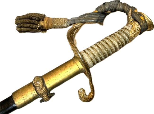 ANTIQUE US M 1852 NAMED NAVY OFFICER DRESS SWORD RESEARCHED: ANTIQUE US M 1852 NAMED NAVY OFFICER DRESS SWORD . VERY GOOD CONDITION OVERALL . NAMED TO C.C.CHAMPION . ETCHED BLADE . SOME AGE SPOTS . ORIGINAL SWORD KNOT AND MUCH GILDING REMAINS ON THE FITTINGS. L
