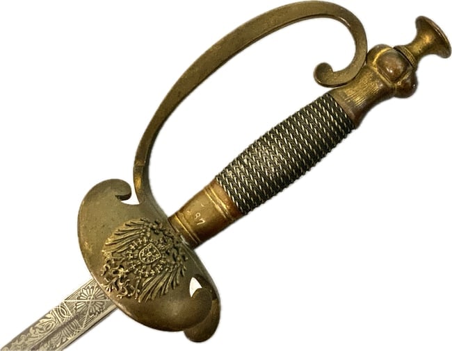 IMPERIAL GERMANY POSTAL PROTECTION OFFICER SWORD PRUSSIA WWI: IMPERIAL GERMANY POSTAL PROTECTION OFFICER SWORD.PRUSSIA. VERY NICE CONDITION RARE SWORD WITH METAL SCABBARD. CIRCE WWI ERA. ETCHED BLADE WKC MARKED. 37" LONG WITH 32" LONG BLADE. GREAT EXAMPLE.