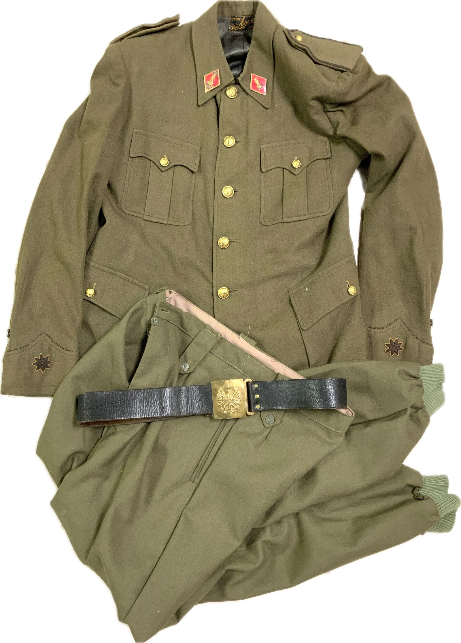SPAIN WWII SPANISH ARMY UNIFORM TUNIC TROUSERS AND BELT: SPAIN WWII SPANISH ARMY UNIFORM TUNIC TROUSERS AND BELT.RARE TO FIND SET. COMPLETE WITH ALL INSIGNIAS.