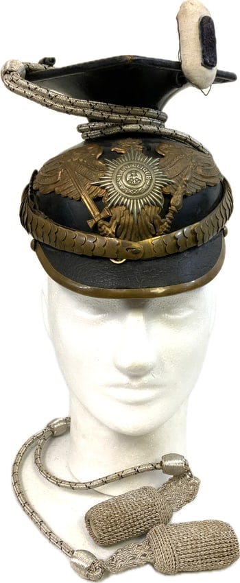 IMPERIAL GERMANY PRUSSIAN GUARD UHLAN REGIMENT NCO OFFICERS HELMET WITH CORDS: IMPERIAL GERMANY PRUSSIAN GUARD UHLAN REGIMENT NCO OFFICERS HELMET WITH CORDS. VERU NICE AND RARE HELMET. COMPLETE WITH CORDS. GREAT CONDITION FOR ITS AGE. LINER INTACT. BEAUTIFUL PIECE TO DISPLAY.