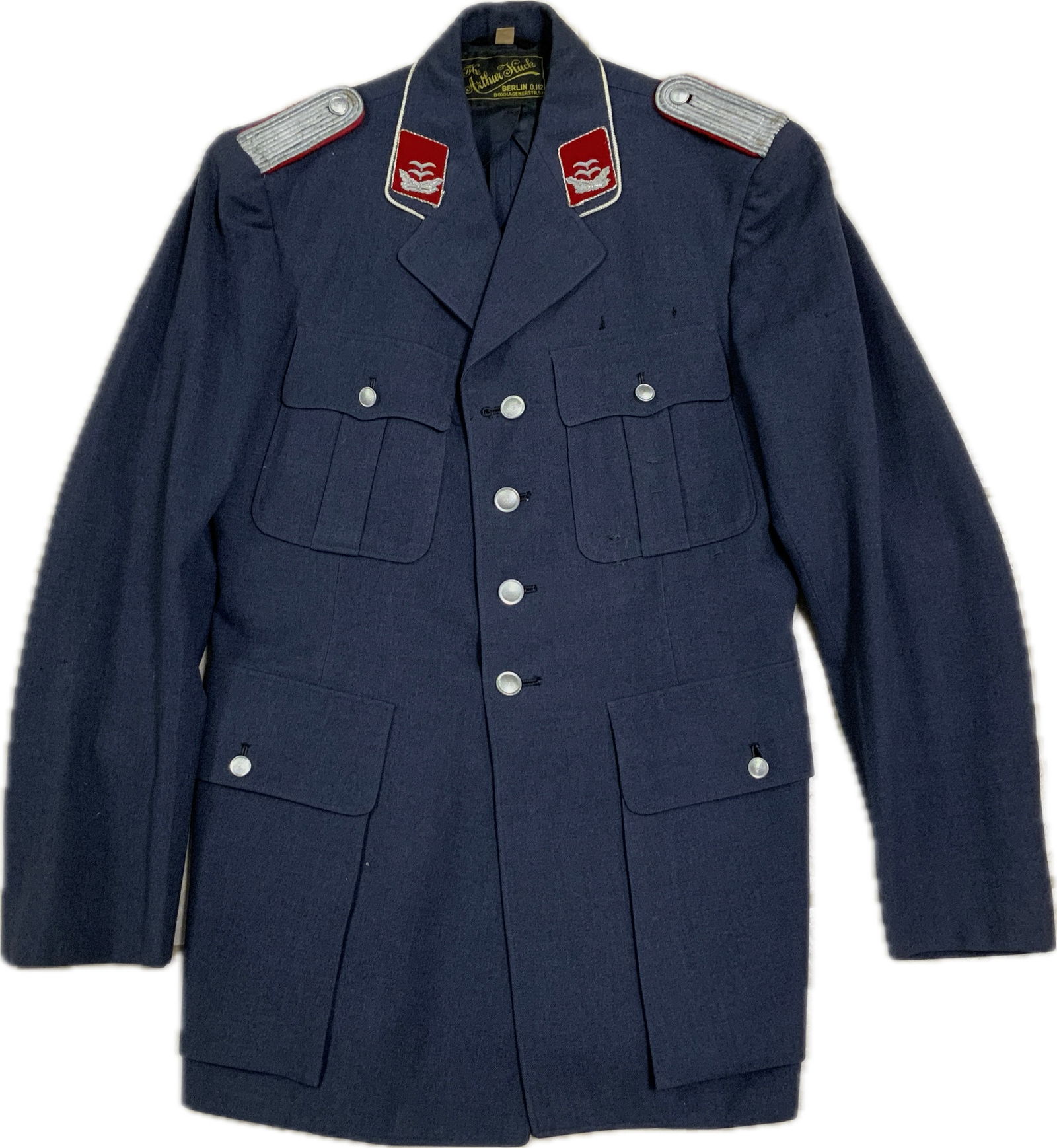EAST GERMANY DDR AIR FORCE OFFICERS UNIFORM TUNIC: EAST GERMANY DDR AIR FORCE OFFICERS UNIFORM TUNIC. EARLY STYLE. NICE AND CLEAN CONDITION. LARGE SIZE. MANY AWARD LOOPS. RARE.