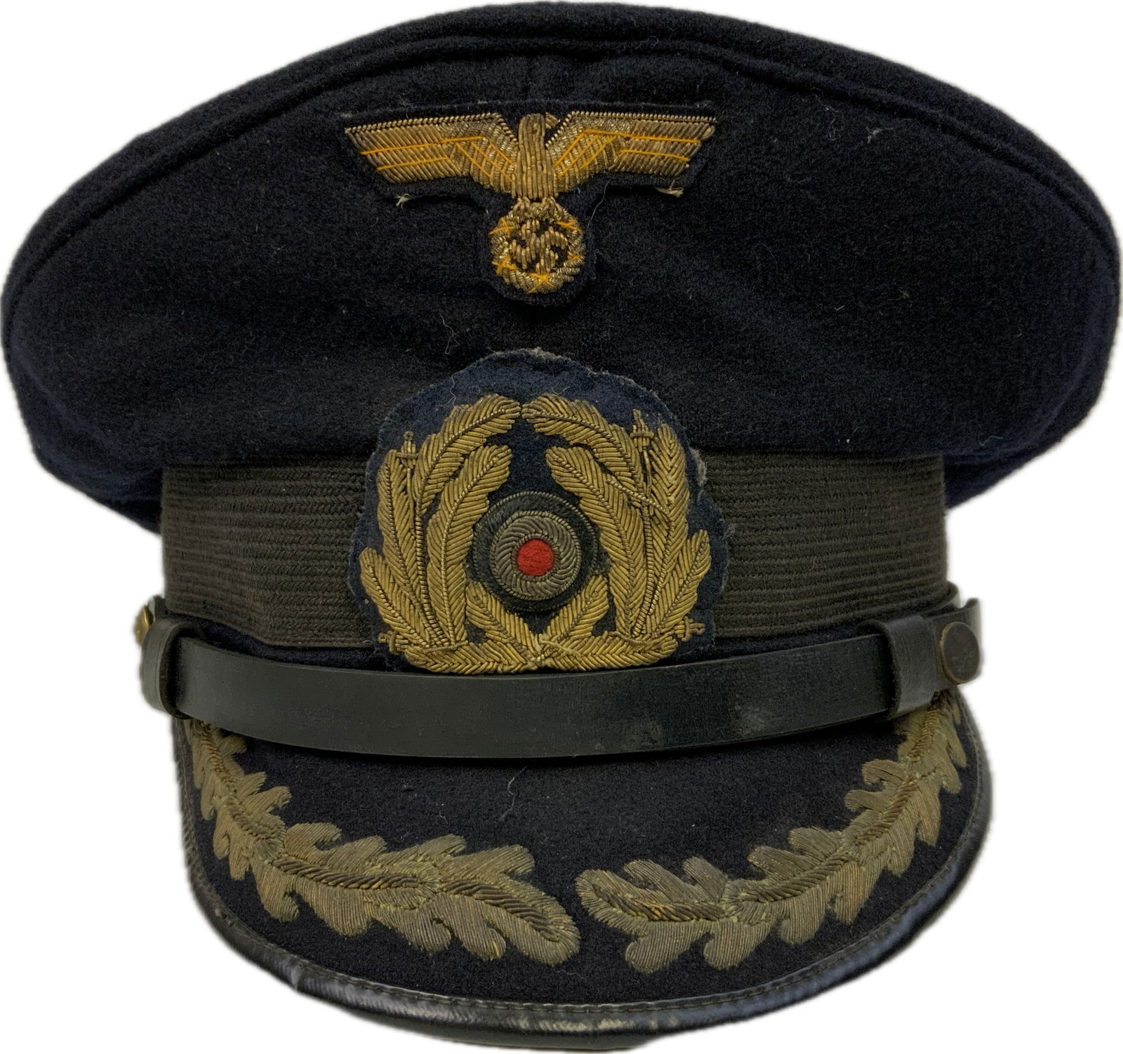 WWII GERMAN NAVY KRIEGSMARINE HIGH RANKING OFFICER BLUE TOP VISOR HAT: WWII GERMAN NAVY KRIEGSMARINE HIGH RANKING OFFICER BLUE TOP VISOR HAT. WELL WORN CONDITION. GOLD WIRE EMBROIDERY ON THE VISOR AND EMBROIDERED INSIGNIA. GOOD OVERALL CONDITION. SIZE 57 MARKED.