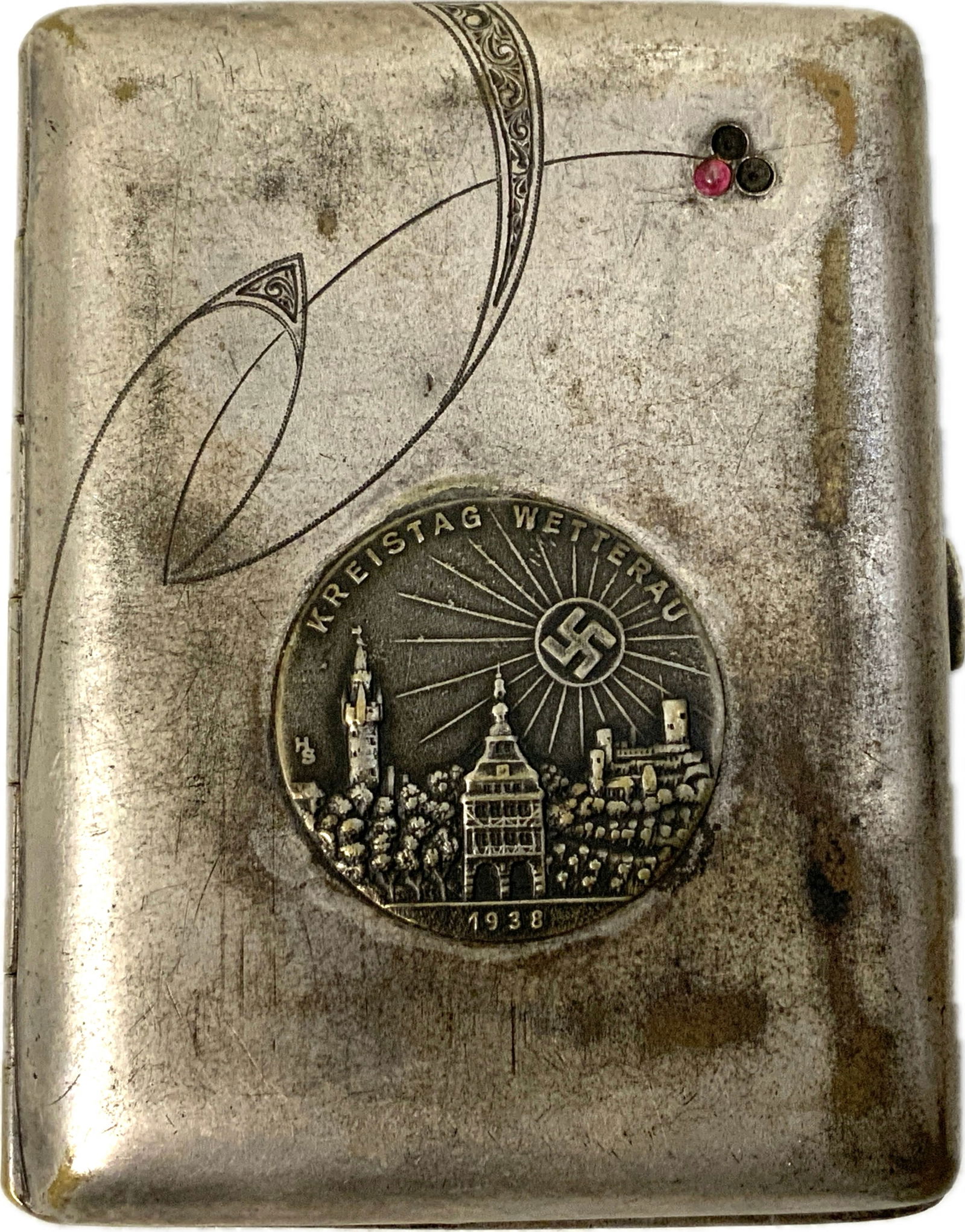 GERMANY THIRD REICH SILVER PLATED CIGARETTE CASE WITH 1938 BADGE: GERMANY THIRD REICH SILVER PLATED CIGARETTE CASE.DECORATIVE ENGRAVED WITH COUPLE STONES MISSING . 1938 DATED BADGE . WELL USED CONDITION. 3 X 4 SIZE.