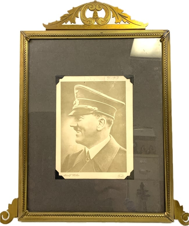 ADOLF HITLER FRAMED PHOTOGRAPH: ADOLF HITLER FRAMED PHOTOGRAPH. FRAMED IN PERION DECORATED FRAME WITH A STAND ON THE BACK. 8 X 10 SIZE.