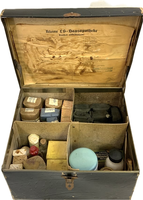 WWII GERMAN LUFTSCHTZ FIRST AID KLEINE HAUSEPOTHEKE WITH CONTENTS: WWII GERMAN LUFTSCHTZ FIRST AID KLEINE HAUSEPOTHEKE WITH CONTENTS. VERY GOOD CONDITION BOX 10 X 12 X 7 SIZE. FULL WITH MEDICAL CONTENTS.