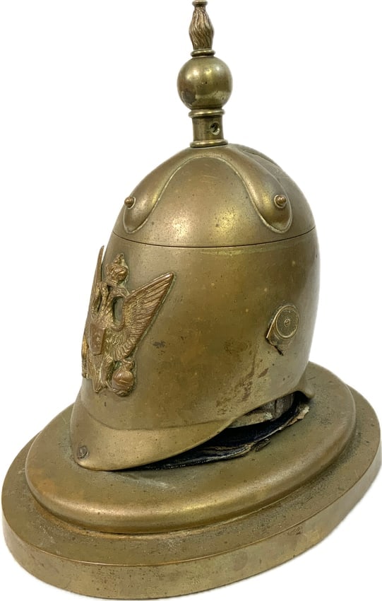 ANTIQUE IMPERIAL RUSSIAN BRASS SPIKED HELMET INK WELL: ANTIQUE IMPERIAL RUSSIAN BRASS SPIKED HELMET INK WELL. VERY NICE AND RARE PIECE. WELL USED BUT STILL GOOD CONDITION FOR ITS AGE. CIRCA MID TO LATE 19TH CENTURY. 8" TALL. APPROX 7" X 5" BASE.