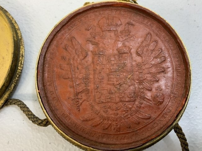 ANTIQUE IMPERIAL AUSTRIA HUNGARY EMPEROR FRANZ JOSEPH I OFFICIAL SEAL: IMPERIAL AUSTRIA HUNGARY EMPEROR FRANZ JOSEPH I OFFICIAL SEAL . RARE ITEM. AN OFFICIAL SEAL OF THE AUSTRIAN HUNGARIAN EMPEROR. LARGE RED WAX SEAL ENCLOSED IN BRASS CASE . STILL HAS ATTACHING CORDS WHI
