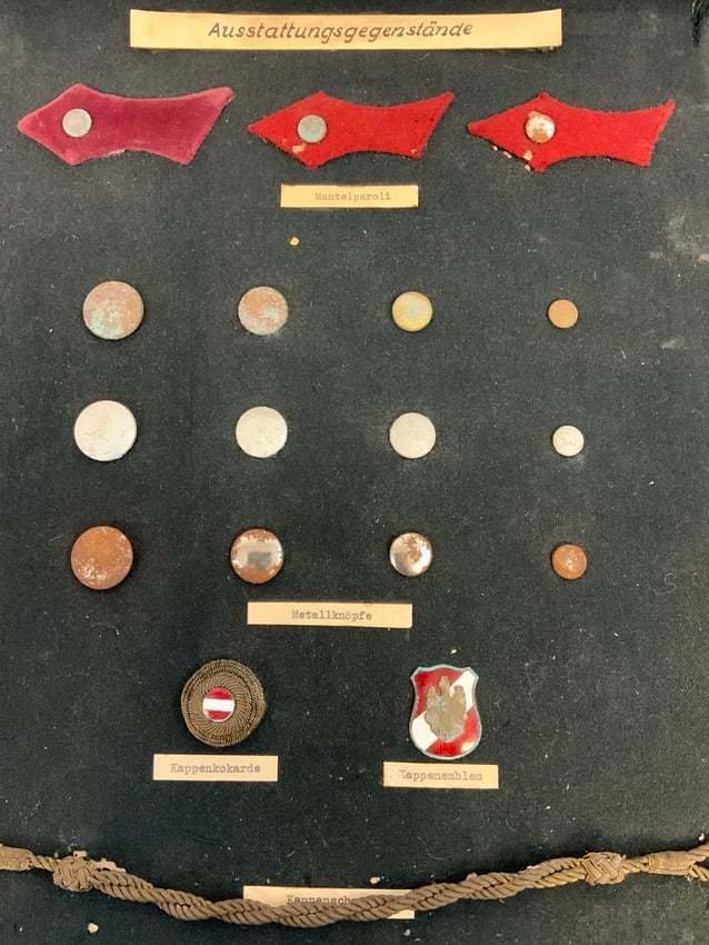 AUSTRIA ANTIQUE POLICE INSIGNIA BUTTONS TABS AND CAP BADGES MOUNTED ON DISPLAY BOARD: AUSTRIA ANTIQUE POLICE INSIGNIA BUTTONS TABS AND CAP BADGES MOUNTED ON DISPLAY BOARD.GREAT HISTORICAL AND DECORATION PIECE. 13X16 SIZE