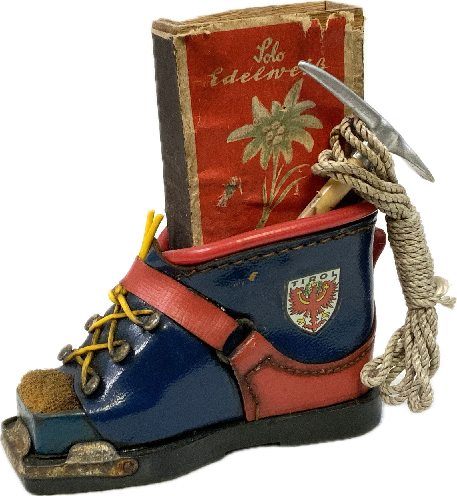 AUSTRIA TIROL INSBRUCK MOUNTAIN BOOT MATCH HOLDER: AUSRIA TIROL INSBRUCK MOUNTAIN BOOT MATCH HOLDER. BEAUTIFUL DECORATOR PIECE. 3 1/2 X 2" TALL SIZE BOOT. COMED WITH EDELWEISS MATCHES.