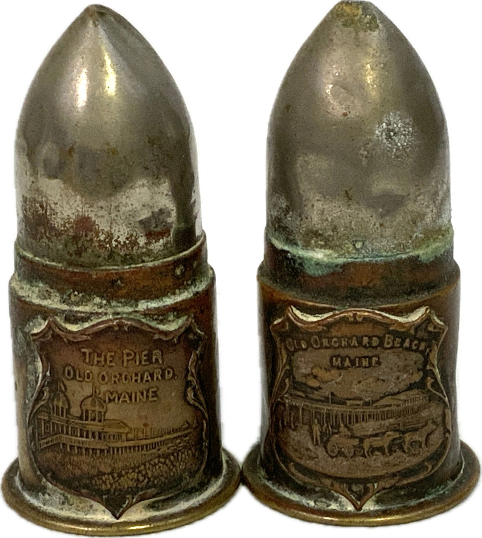 DECORATIVE ANTIQUE OLD ORCHARD MAINE BULLETS: DECORATIVE ANTIQUE OLD ORCHARD MAINE BULLETS. CIRCA 1920'S. MARKED. 3" TALL.