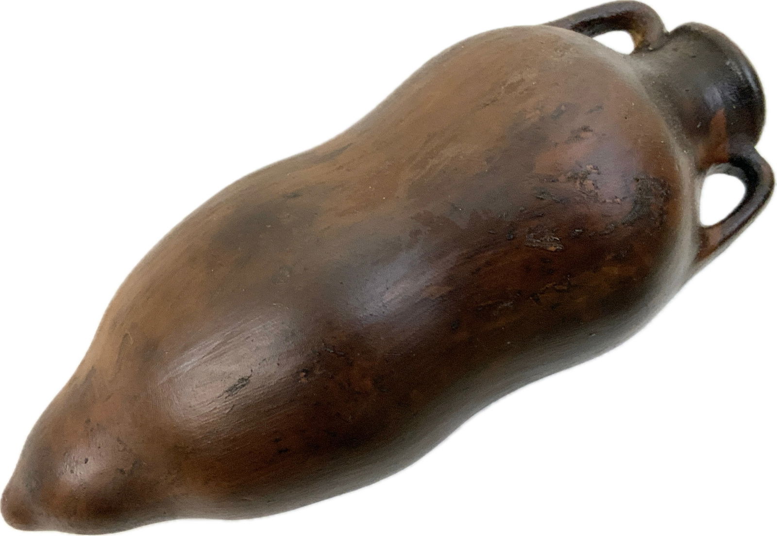 ANCIENT GREEK AMPHORA: ANCIENT GREEK AMPHORA.COVERED WITH PROTECTIVE VARNISH.PLAKA,GREECE. 8" LONG. APPROX. 3" DIAM. FROM DR. PAUL D. LYNN COLLECTION.