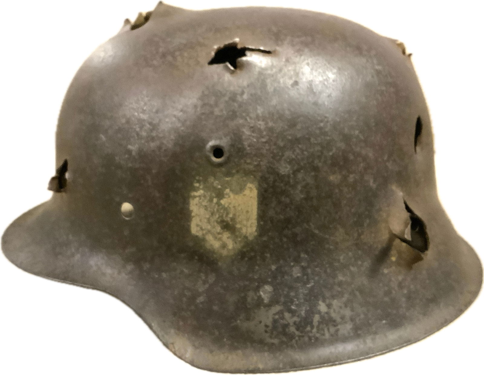 WWII GERMAN BATTFIELD RELIC M42 HELMET: WWII GERMAN BATTFIELD RELIC M42 HELMET.EXTENSIVE DAMAGE FROM BULLETS AND SHRAPNEL. BATTLEFIELD RECOVERED IN STALINGRAD AREA , VOLGOGRAD RUSSIA. GOOD SOLID CONDITION.
