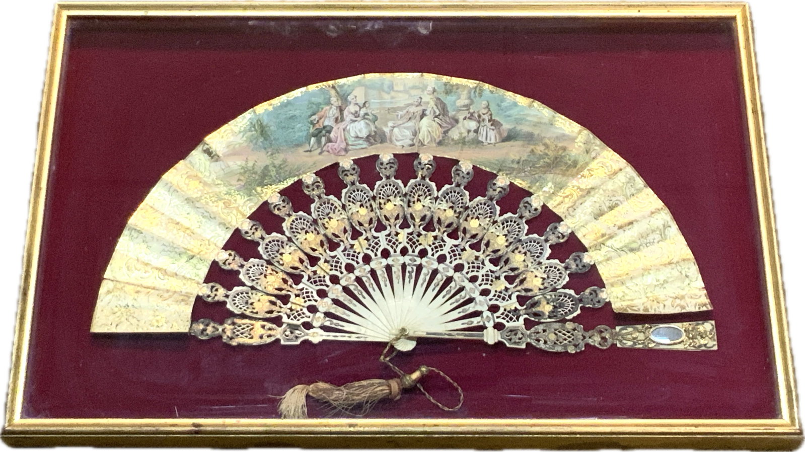 ANTIQUE FRENCH 19th CENTURY LARGE LADY'S FAN FRAMED AND MOUNTED: ANTIQUE FRENCH 19th CENTURY LARGE LADY'S FAN FRAMED AND MOUNTED. BEAUTIFUL HIGH-QUALITY PIECE WITH PAINTED SCENE AND DETAILS. APEARS TO BE DECORATED AND GILDED BONE CARVED VANES. INCLUDES PERSONAL LAD