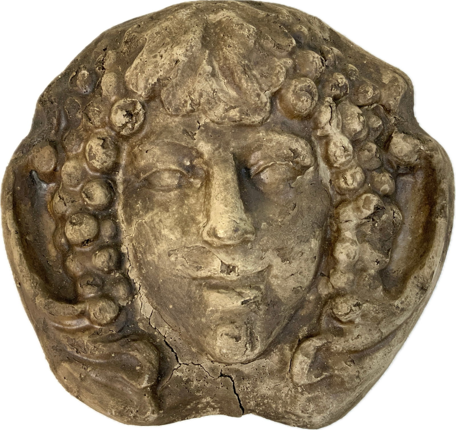 ANTIQUE DIONYSUS TERRACOTTA MASK: ANTIQUE DIONYSUS TERRACOTTA MASK.9 1/2" X 9" SIZE. OLD REPAIRS. BOETIA ARCHITECTURAL GARDEN SALVAGE. EX.TURIN COLLECTION , ITALY.SOME CRACKS. FROM DR. PAUL D. LYNN COLLECTION.