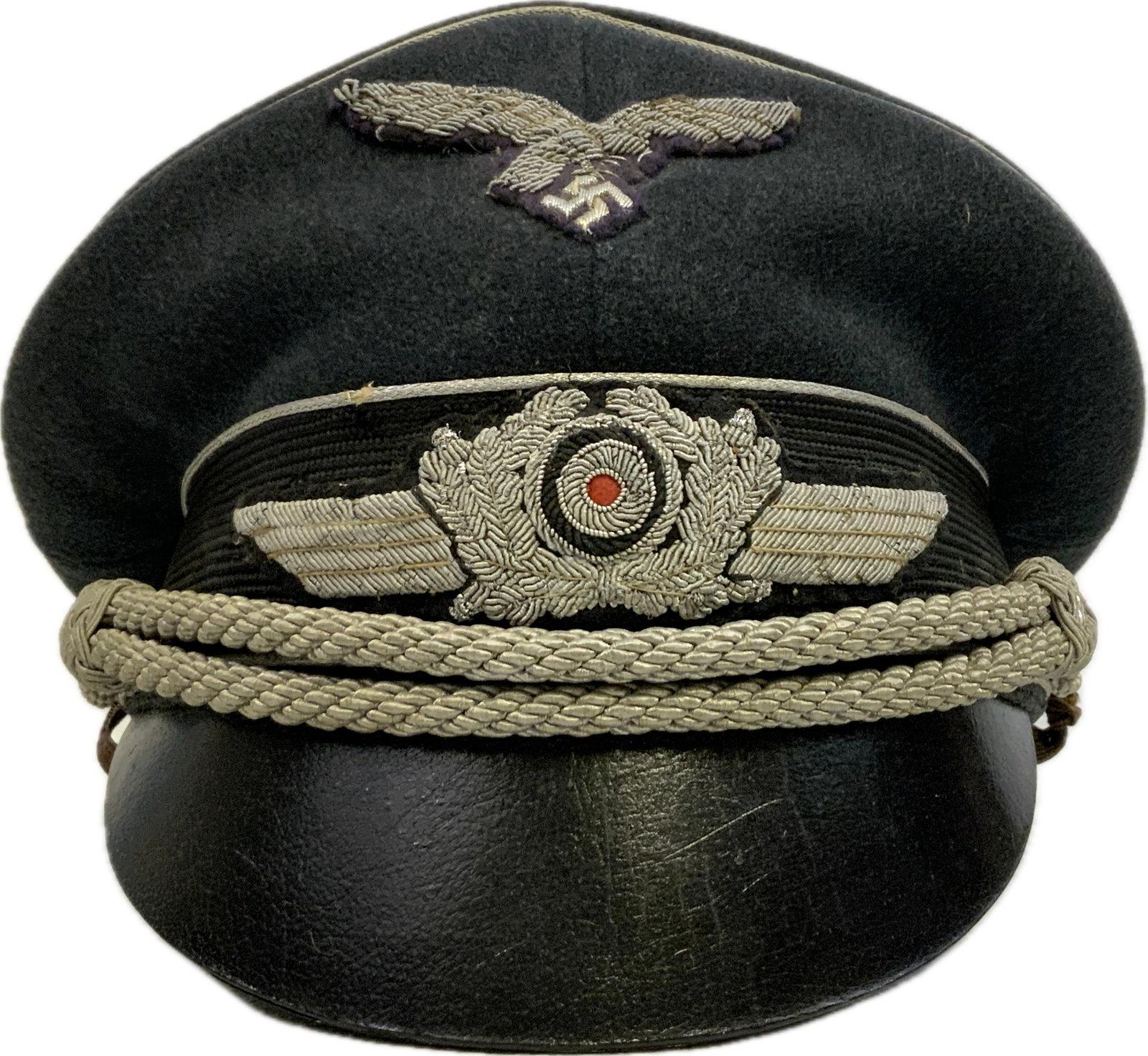 WWII GERMAN LUFTWAFFE OFFICERS VISOR CAP HAT: WWII GERMAN LUFTWAFFE OFFICERS VISOR CAP HAT.FINE HAT IN VERY NICE WELL USED CONDITION.LEATHER VISOR. WELL WORN INSIDE WITH MAKER INFORMATION.EXTRA STRAP PERIOD ADDED.GREAT SADDLE SHAPE POPULAR WITH
