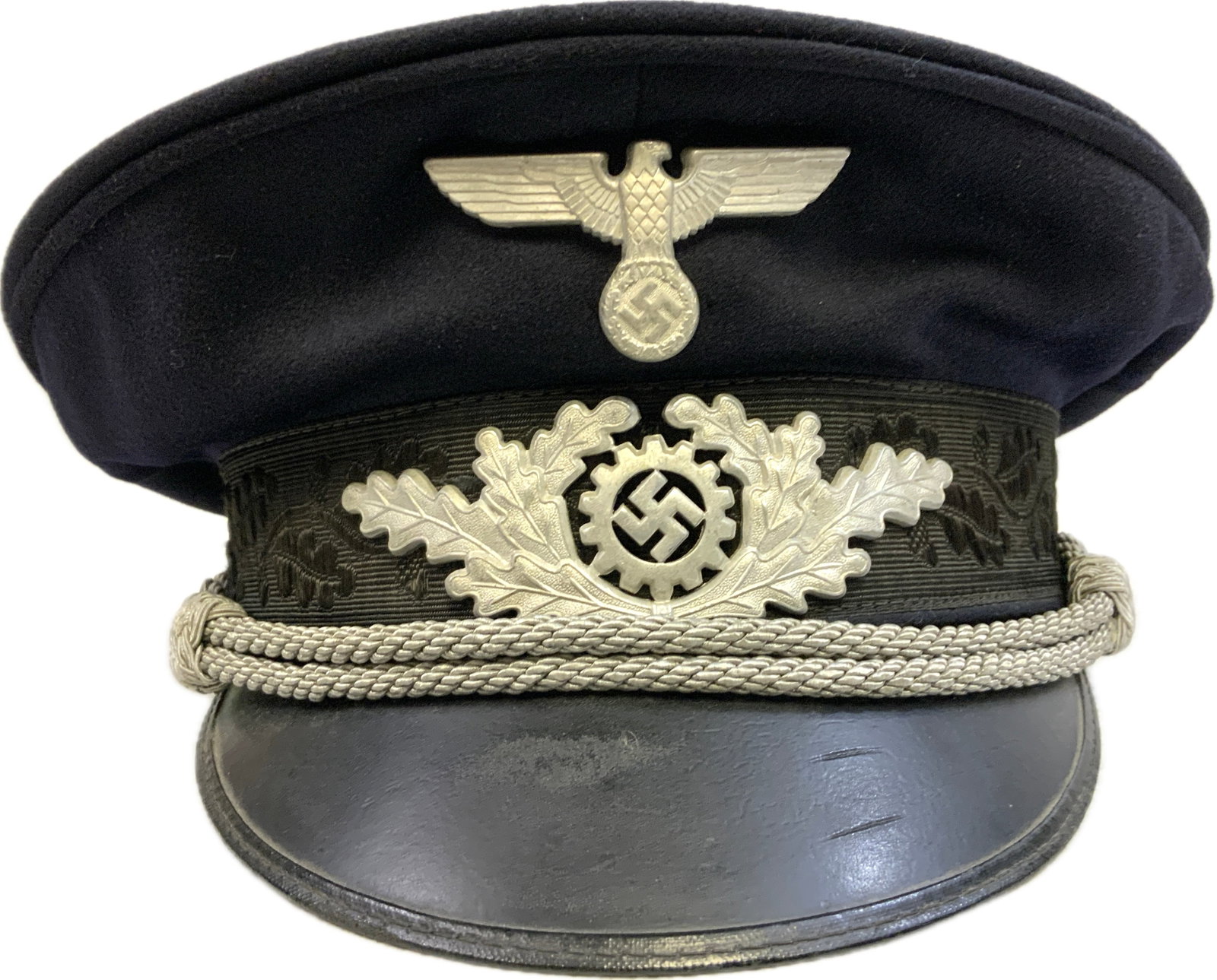 WWII GERMAN DAF OFFICERS VISOR CAP: WWII GERMAN DAF OFFICERS VISOR CAP.VERY NICE AND CLEAN NEAR MINT EXAMPLE WITH ALUMINUM INSIGNIA. RZM TAG INSIDE. SIZE ABOUT 57. RARE TO FIND.