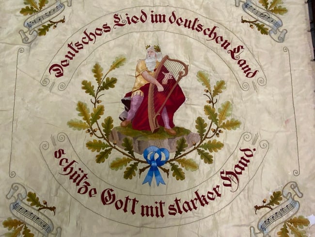 1930 GERMAN SINGERS SOCIETY DOUBLE SIDED EMBROIDERED BANNER WITH POLE.: 1930 GERMAN SINGERS SOCIETY DOUBLE SIDED EMBROIDERED BANNER WITH POLE.Magnificent piece. This is rare German singers' society banner (a Gesangverein).45" x 41" size with fringes. Complete 2 piece