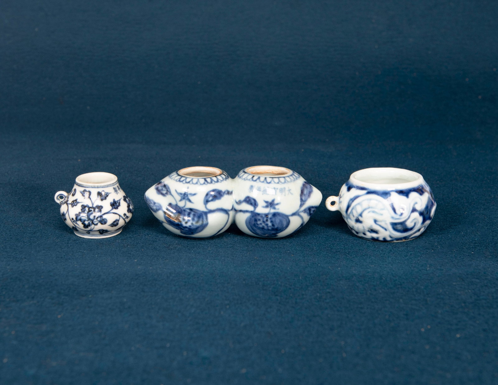 Three Chinese Blue and White Bird Feeders: H:4.7cm, varying sizes
