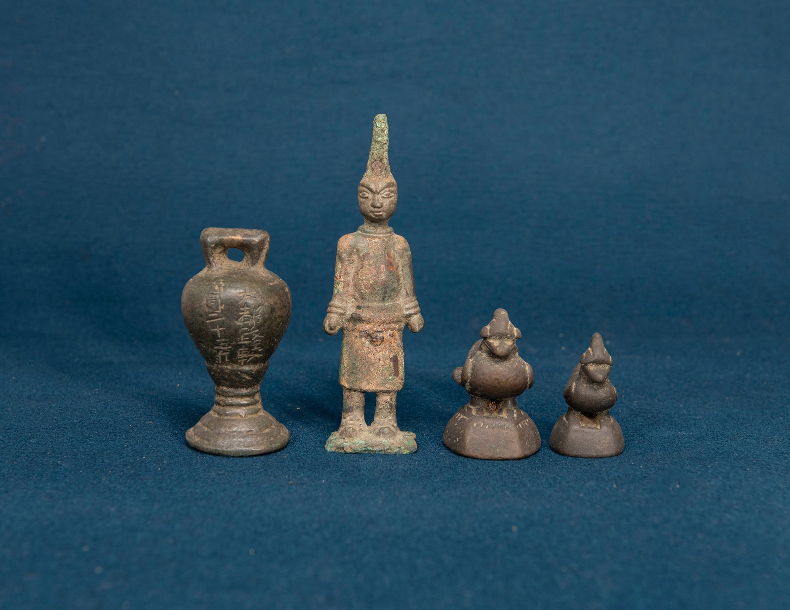 A Chinese Bronze Figurine, Three Chinese Bronze Weights: H:9.2cm , varying sizes