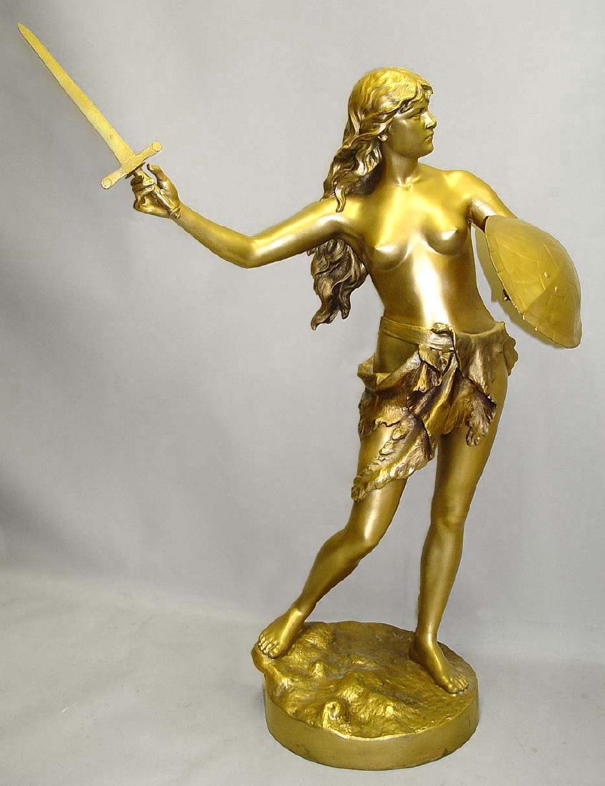 20TH CEN. FRENCH GILT METAL AMAZON WARRIOR STATUE: Early 20th century French gilt metal Amazon warrior sculpture signed J. Garnier on the base, depicting a lovely flowing hair semi nude female brandishing a tortoise shield and sword at the ready, with