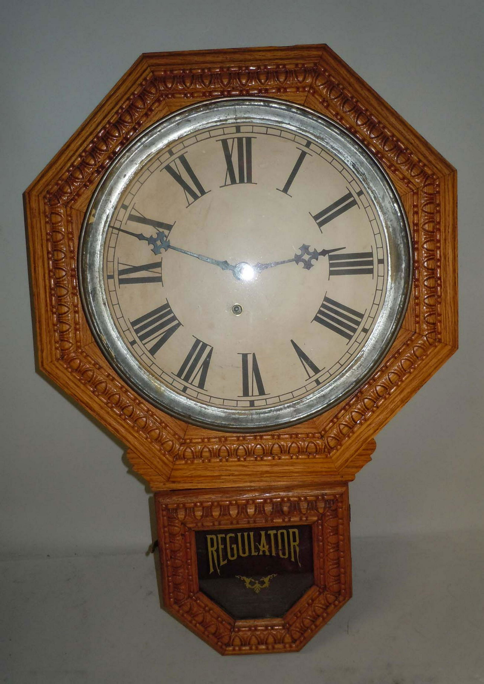 GOLDEN OAK OCTAGON SCHOOL HOUSE REGULATOR WALL CLOCK: GOLDEN OAK OCTAGON SCHOOL HOUSE REGULATOR WALL CLOCK This is a Rare Antique Working Turn Of The Century Oak Octagon Drop Regulator School House Wall Clock, with a golden mellow blond Oak wood case wit