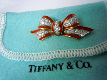 TIFFANY 18K DIAMOND ENAMEL BOW BROOCH, DONALD CLAFLIN: TIFFANY 18K DIAMOND ENAMEL BOW BROOCH, DONALD CLAFLIN Diamond, Enamel, Platinum & Gold ribbon/bow brooch, Attrib: Donald Claflin for Tiffany & Co., circa 1970 The brooch features pave set full-cut di