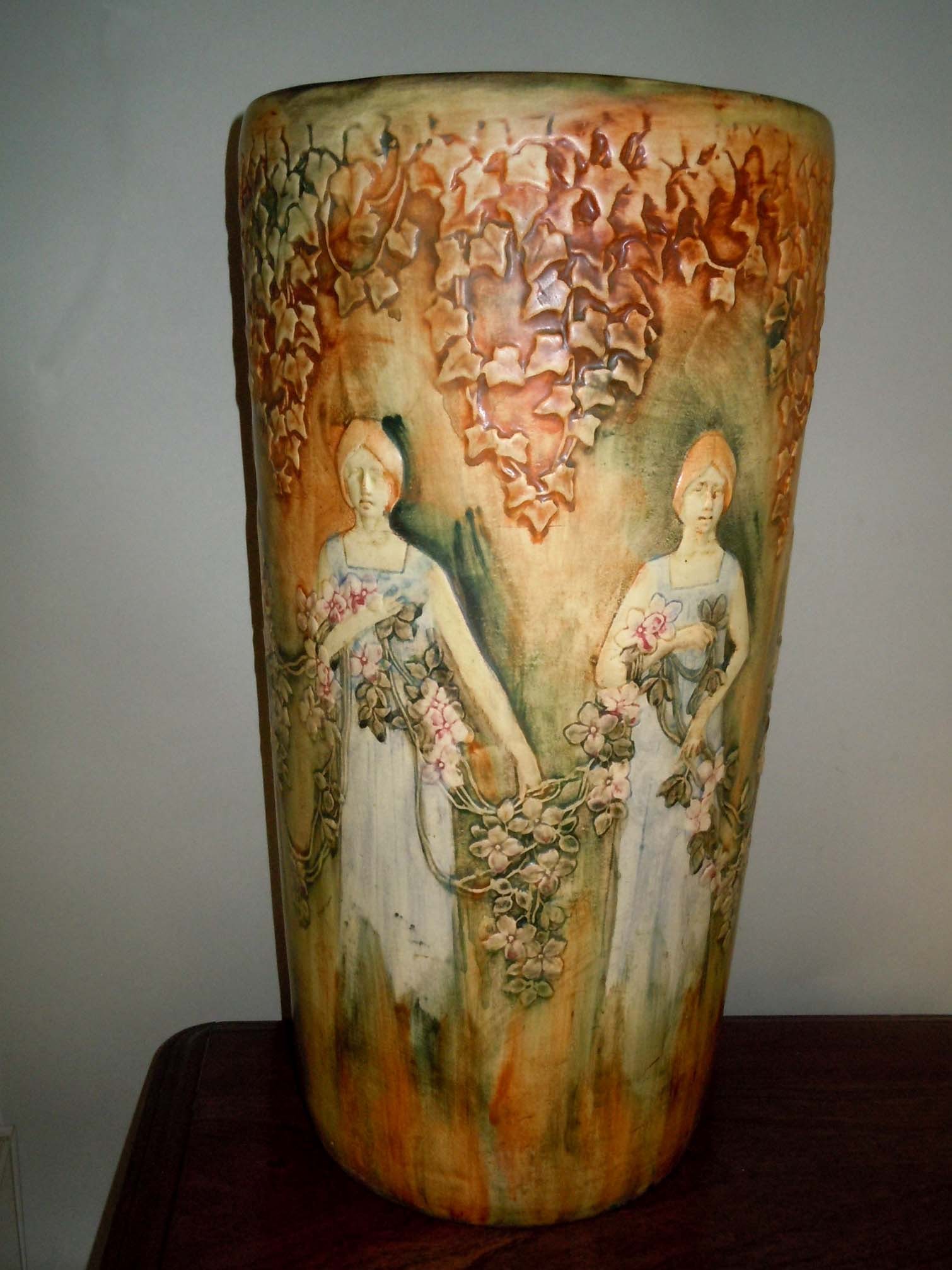 WELLER FLEMISH UMBRELLA STAND WOMEN DOGWOOD WREATH    DETAILS:   - TOTAL HEIGHT: 20 In. HEIGHT.  - (1 of 5)