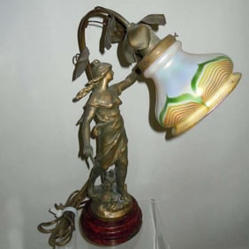 QUEZAL PULLED FEATHER SHADE FEMALE FIGURAL DESK LAMP, Circa 1915 depicting a beautiful fairy holding