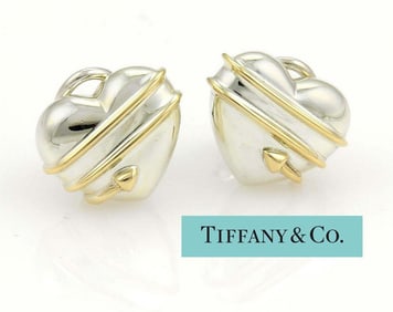 TIFFANY CUPID ARROW HEART EARRINGS 18Kt GOLD and SILVER This lovely and elegant pair of earrings