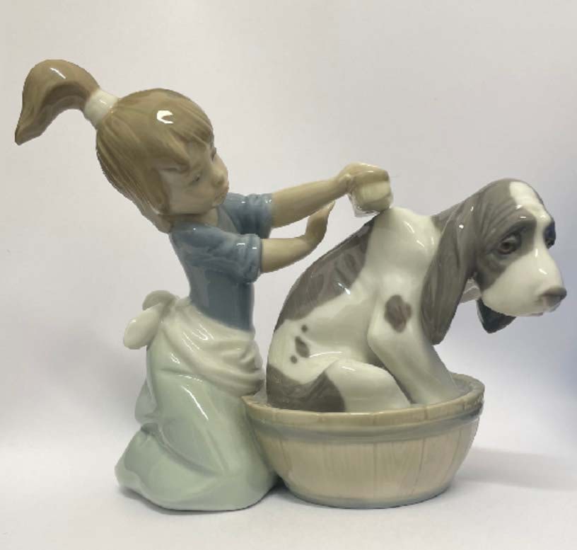 LLADRO 5455 BASHFUL BATHER DOG PORCELAIN FIGURINE GIRL PUPPY This Lladro 5455 is the 'Bashful: LLADRO 5455 BASHFUL BATHER DOG PORCELAIN FIGURINE GIRL PUPPY This Lladro 5455 is the 'Bashful Bather' figurine from the Childhood Collection. It depicts a young girl scrubbing her basset hound dog in 