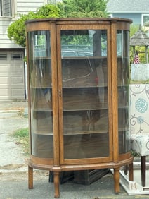 TIGER OAK BOW FRONT BENT GLASS CURIO CHINA CABINET, Ca. 1900     An outstanding Tiger Oak Bow Front