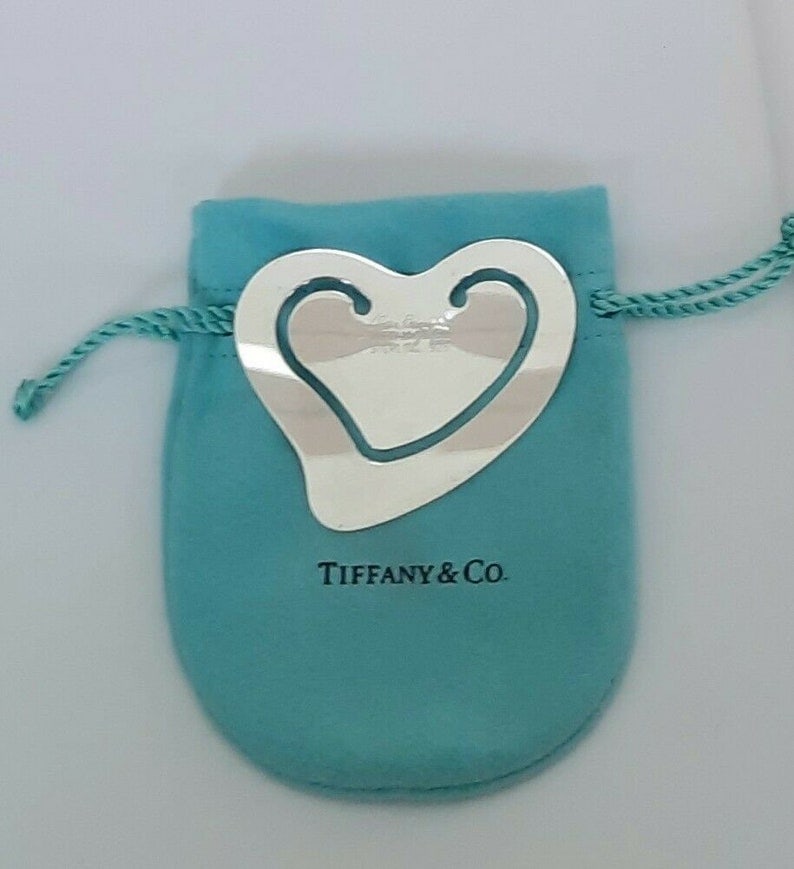 TIFFANY STERLING SILVER PERETTI OPEN HEART BOOKMARK: TIFFANY STERLING SILVER PERETTI OPEN HEART BOOKMARK An outstanding pre-owned hard to find Sterling Silver Tiffany & Co. Elsa Peretti Open Heart Shaped Bookmark, comes pre-polished & ready to use with 