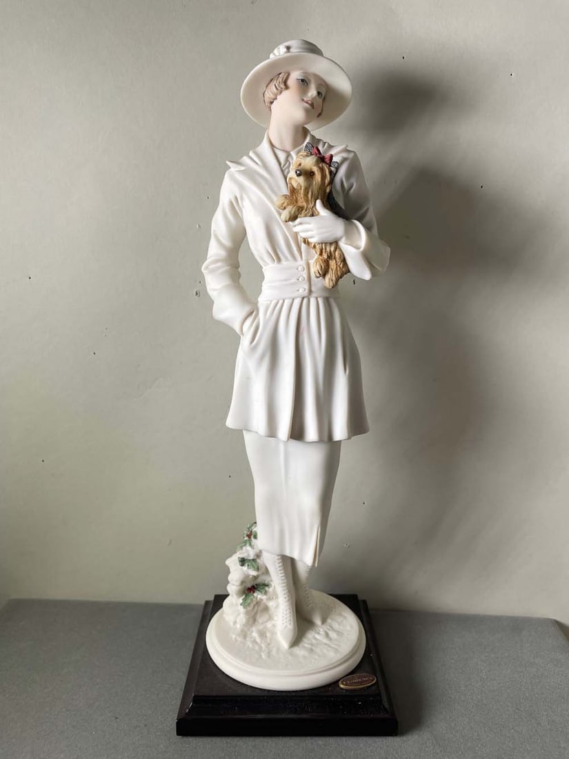 GIUSEPPE ARMANI 'CHILLY' 1477F LADY WITH YORKIE SCULPTURE FIGURINE DOG DETAILS: - SIZE: 11-3/4: GIUSEPPE ARMANI 'CHILLY' 1477F LADY WITH YORKIE SCULPTURE FIGURINE DOG DETAILS: - SIZE: 11-3/4 In. (with base). BACKGROUND: Giuseppe Armani was born in Calci, Italy, in 1935. From the moment young 'Be