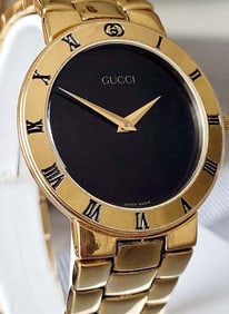MENS 33MM GUCCI 3300.2.M WATCH GOLD TONE BLACK DIAL ROMAN NUMERAL BEZEL, SWISS QUARTZ WRISTWATCH