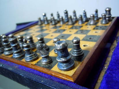 COLLINS COOK EDWARDIAN STERLING SILVER TRAVEL CHESS SET A rare diminutive Edwardian C1906: COLLINS COOK EDWARDIAN STERLING SILVER TRAVEL CHESS SET A rare diminutive Edwardian C1906 English Sterling silver travel chess set with original black leather bound velvet and silk lined case. The boa