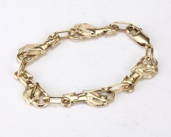 VINTAGE 14K YELLOW GOLD LION CHAIN LINK BRACELET   Marked '14K' featuring high relief polished and
