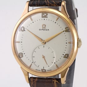 A TRESOR or JUMBO 18KT GOLD OMEGA CALIBER 265 15J MENS MANUAL WATCH, CA. 1954-1960   Brand: Omega